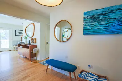 When you enter the front door, you'll find this entryway that leads to the living room, kitchen and bedrooms.