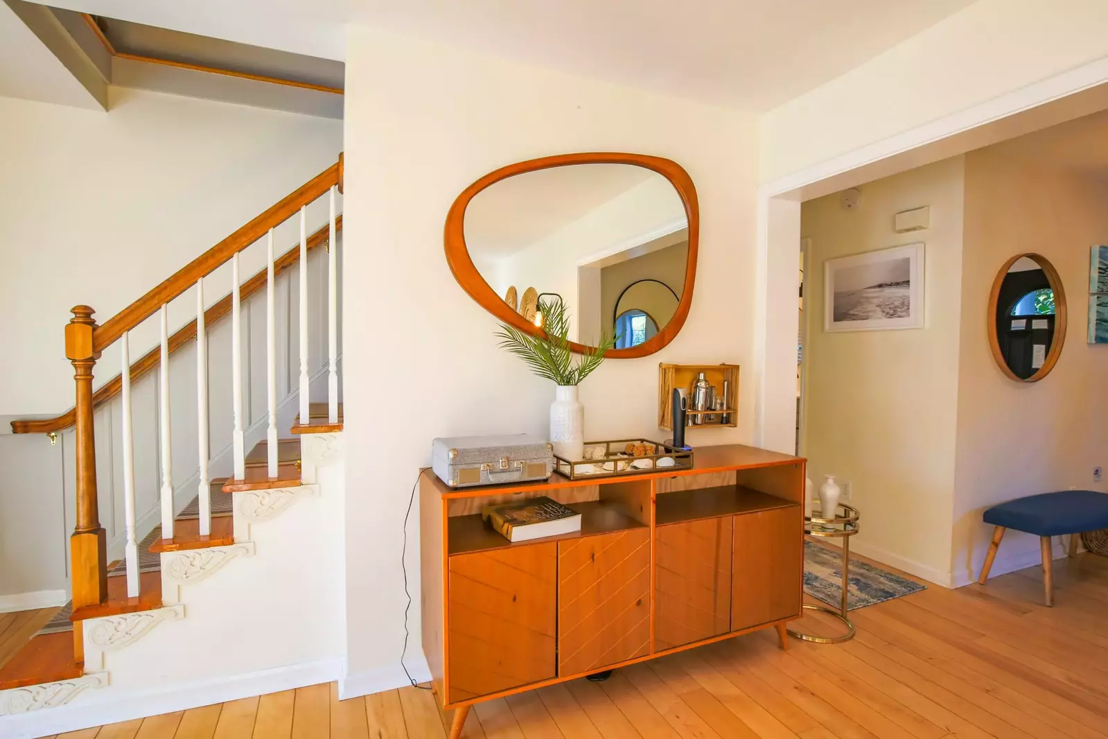 This staircase leads to the upstairs bedrooms.  The hallway leads to the downstairs bedrooms.