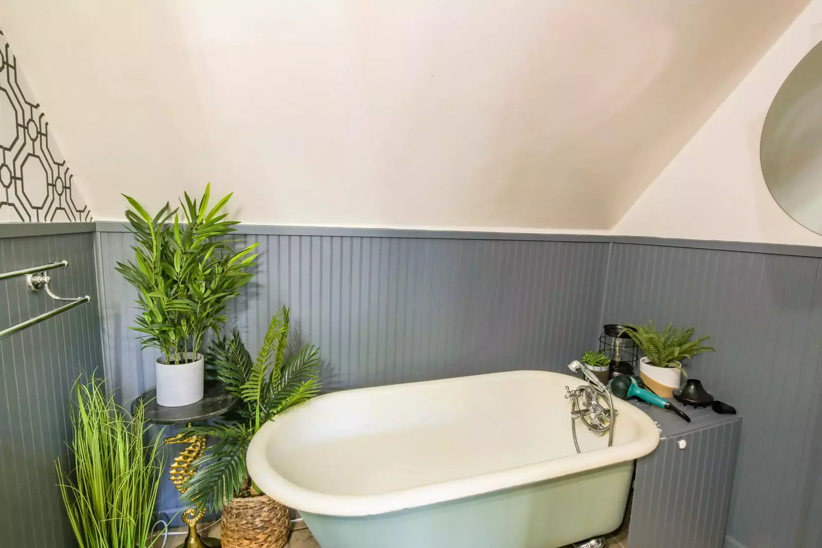 This second floor bathroom has a clawfoot tub.