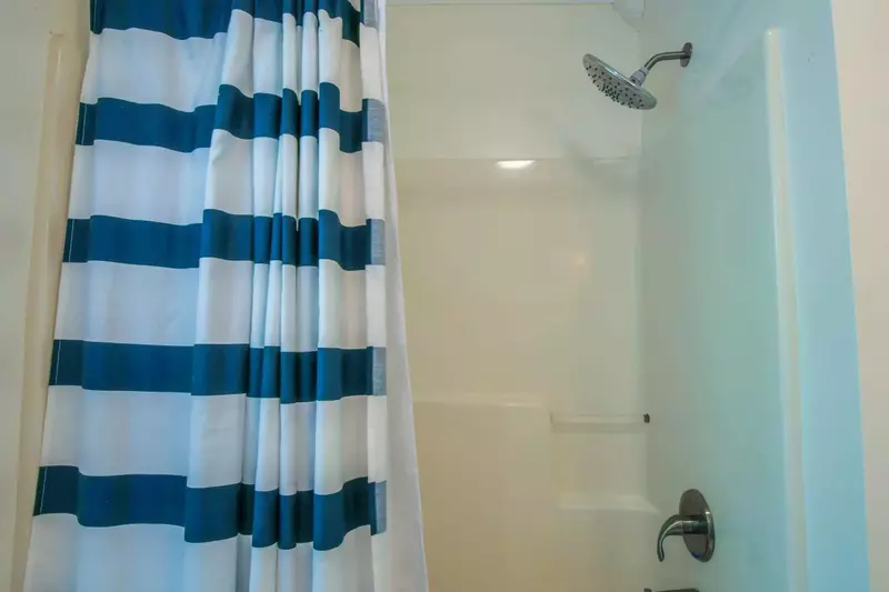 The lower level bathroom also has a shower/tub combo.