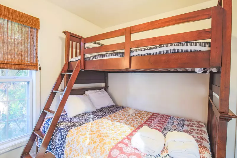 This bunk bedroom -- with a full bed on the bottom and a twin bed on the top -- is located on the home's lower level.