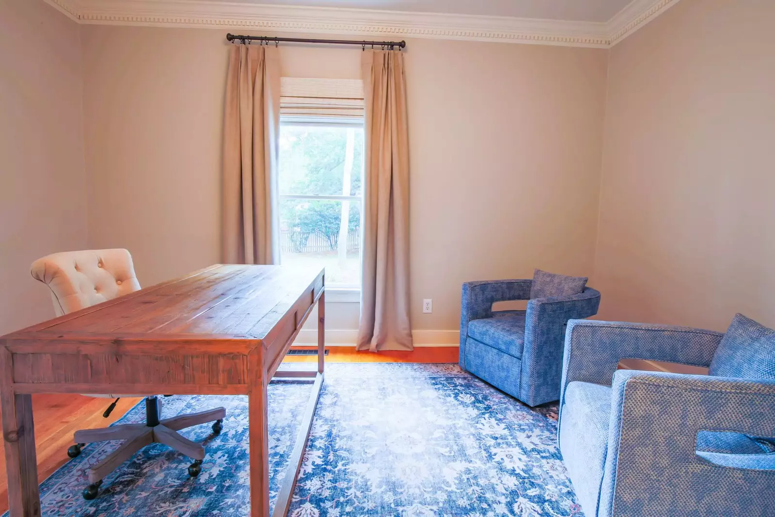 This home office is located on the ground floor in between the kitchen and front door entryway.