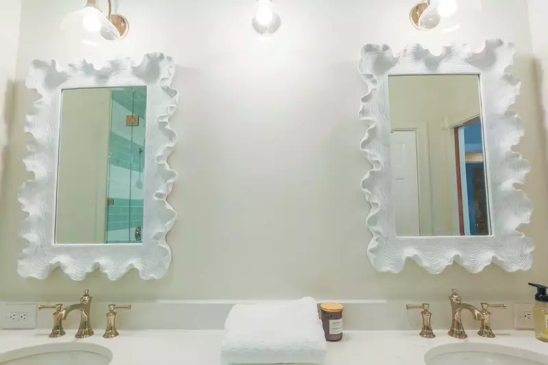 The en suite bathroom for the master bedroom features a double sink vanity.