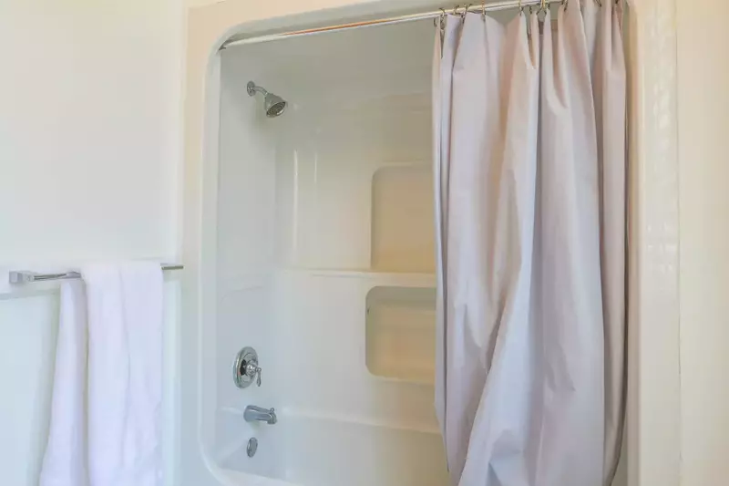 The second floor hallway bathroom also has a shower/tub combo.