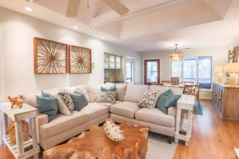 The home is centered around the living room with its spacious seating area and hardwood floors.