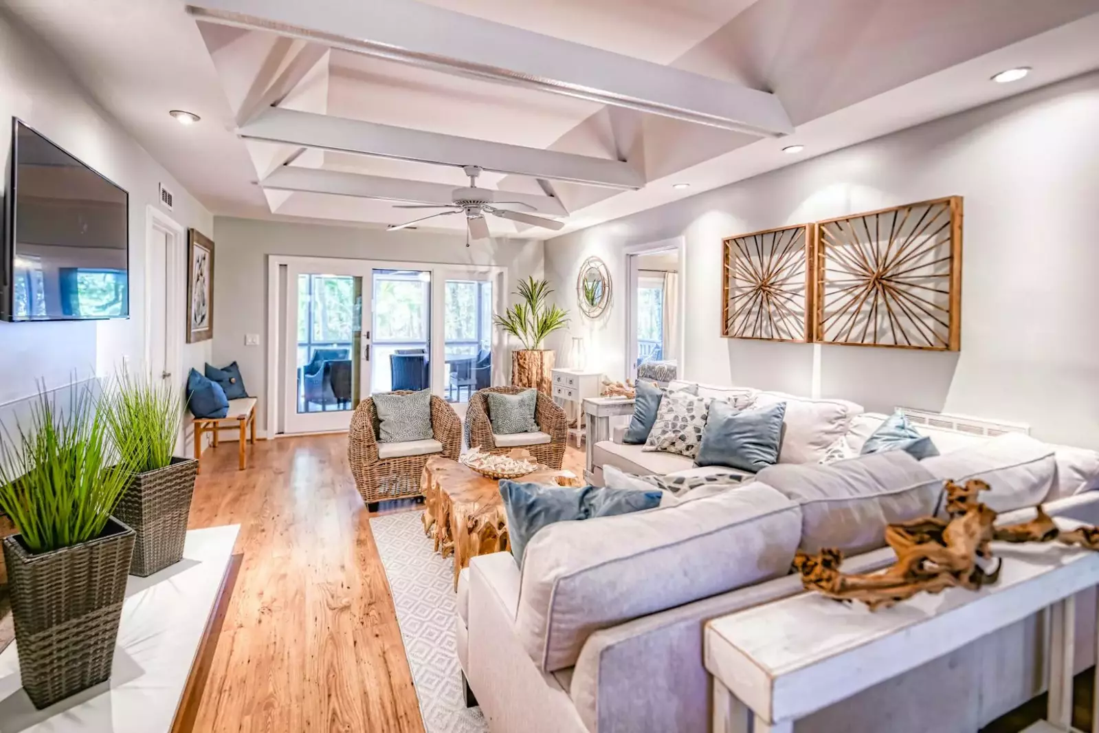 The home's three bedrooms, the kitchen and the screened porch all extend off of the living room.