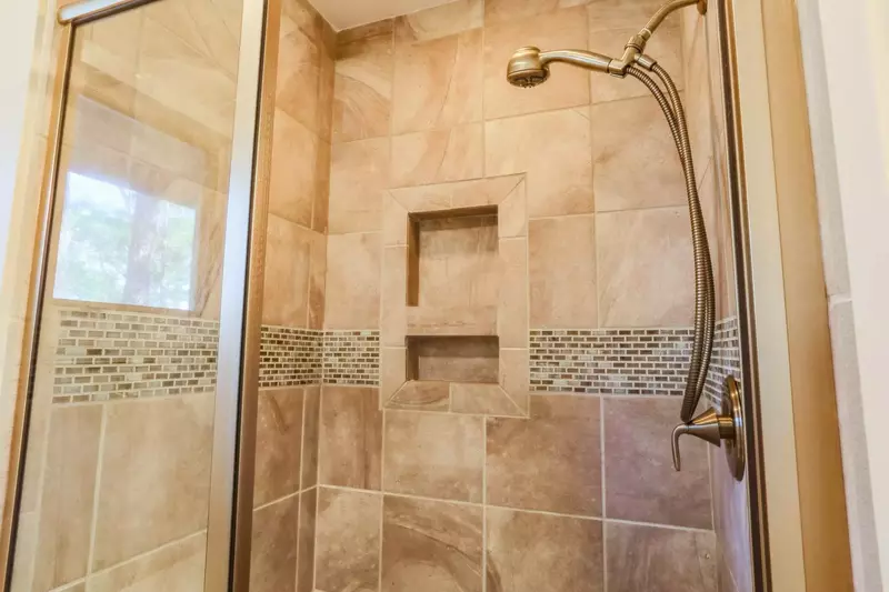 The master bathroom has a tiled, walk-in shower.