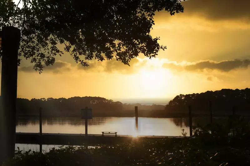 The community dock looks westward across the Kiawah River -- perfect for sunsets!