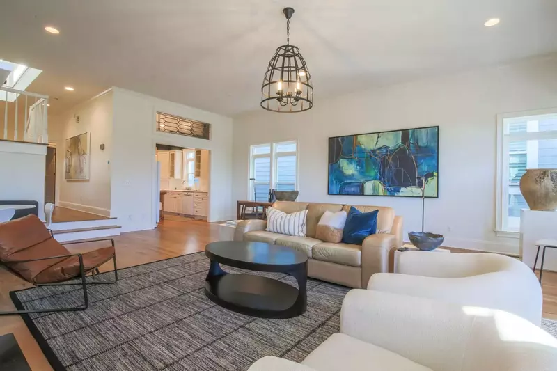 The kitchen opens onto the living room and dining area.