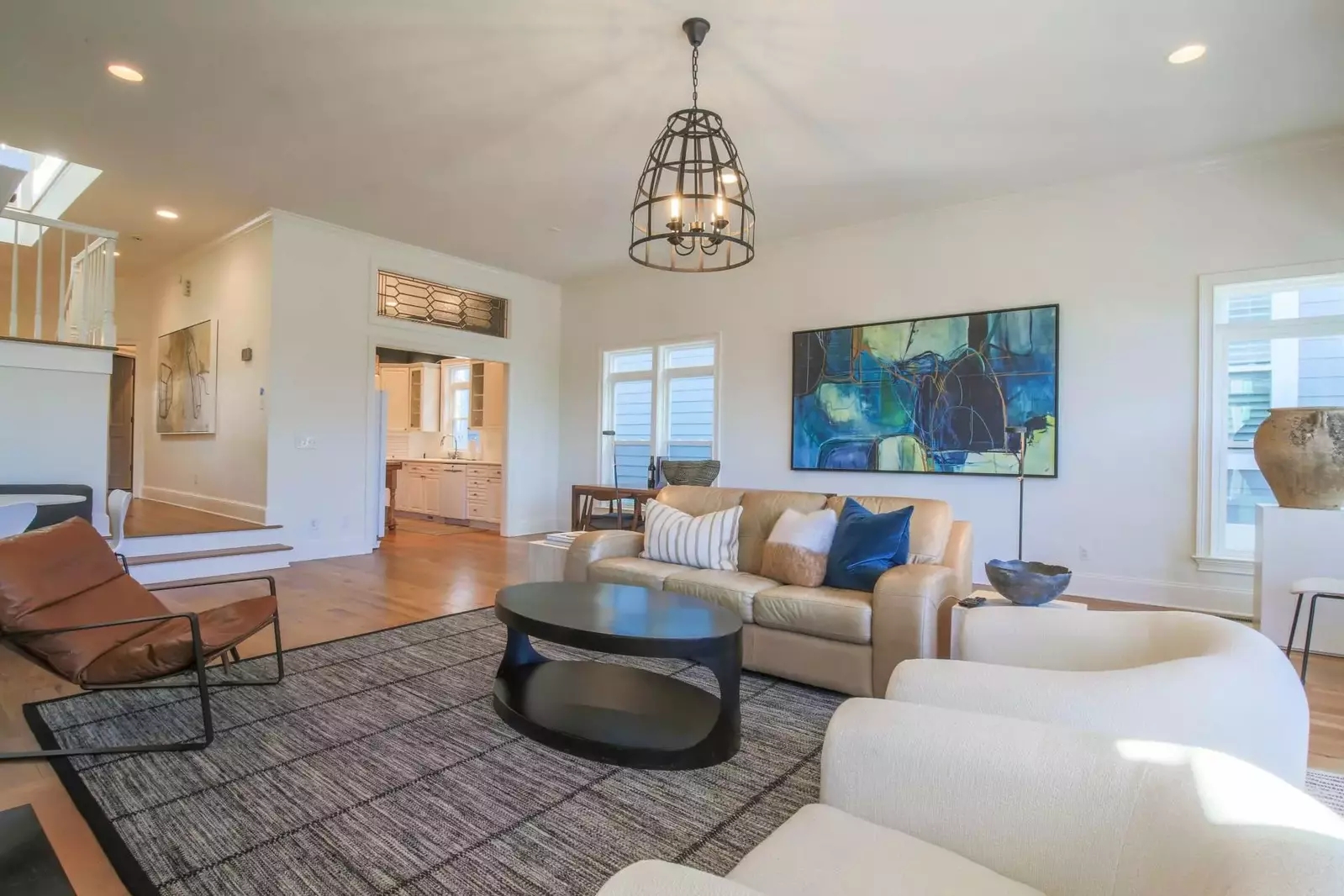 The kitchen opens onto the living room and dining area.