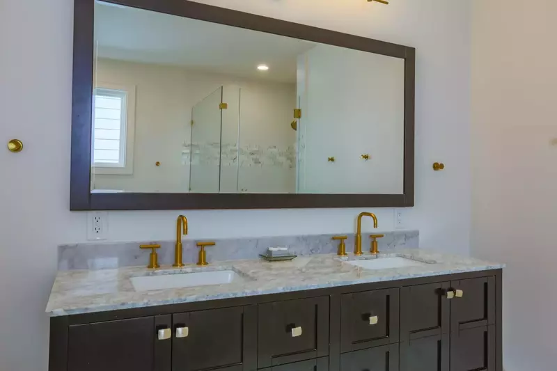 This bathroom in the master suite features a double sink vanity.