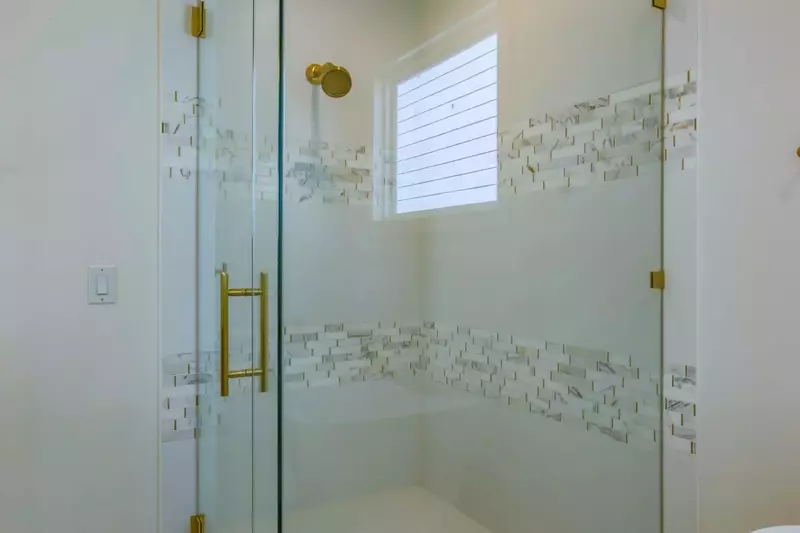 The master bathroom also has this gorgeously tiled, walk-in shower.
