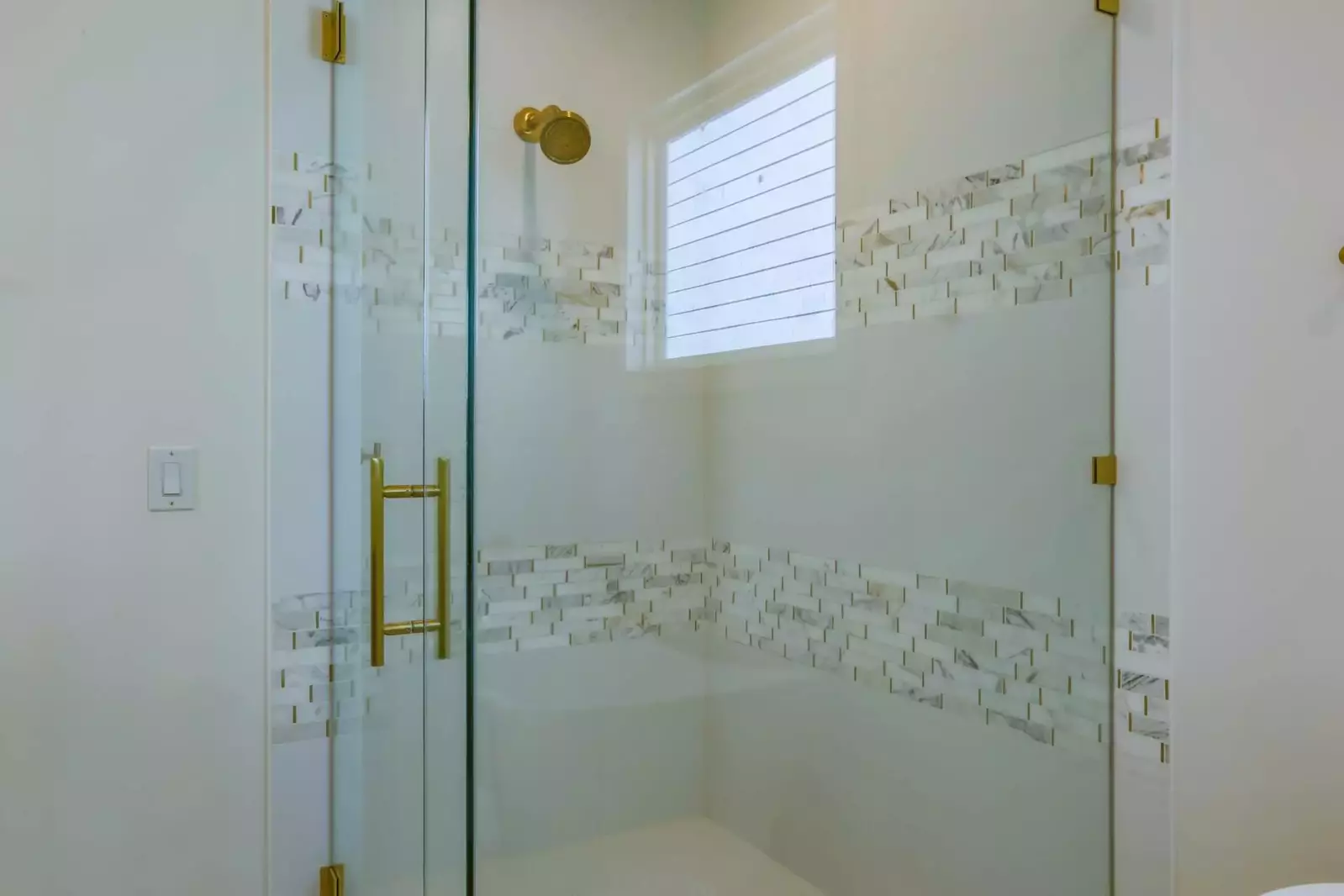 The master bathroom also has this gorgeously tiled, walk-in shower.