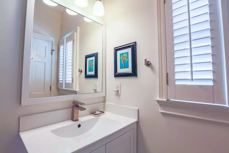 The en suite bathroom has a spacious vanity.