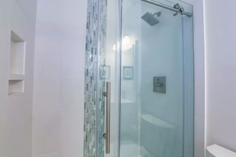 The en suite bathroom also has a tiled, walk-in shower.