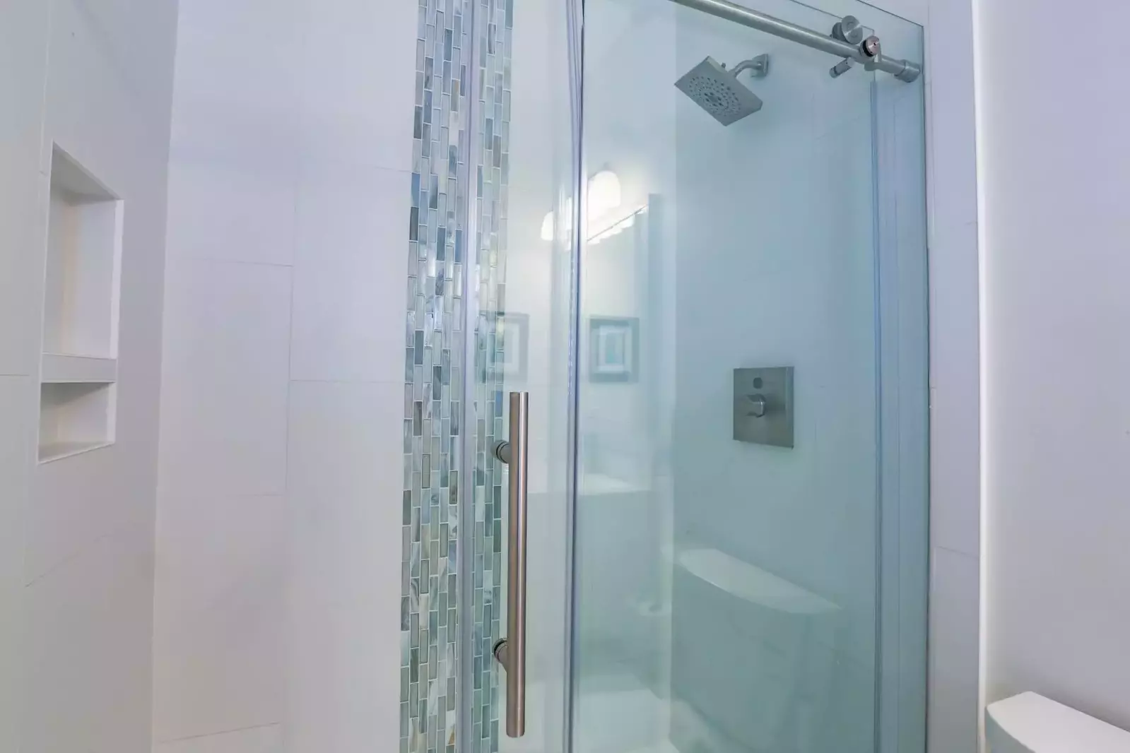 The en suite bathroom also has a tiled, walk-in shower.