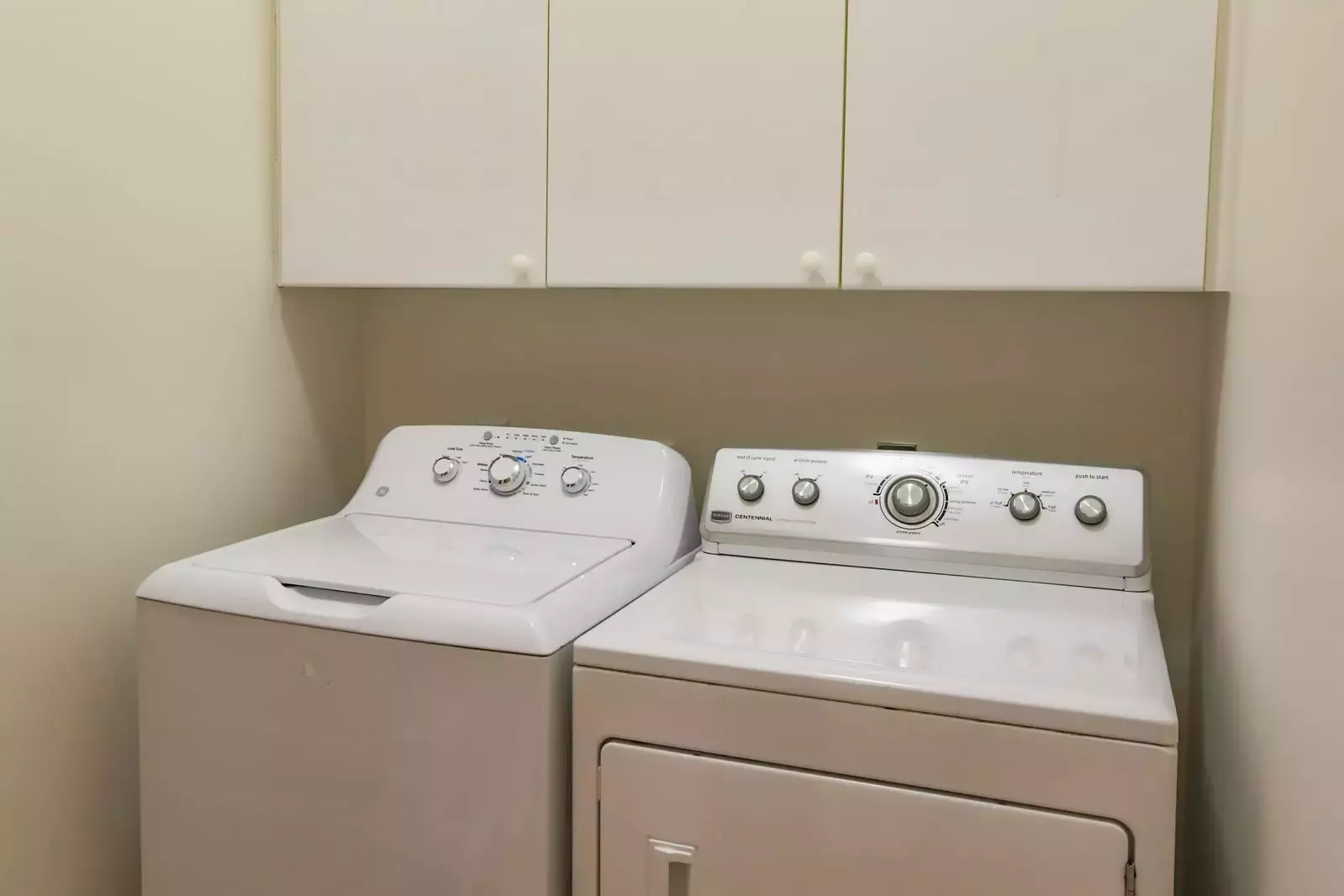 There is a full sized washing machine and dryer in the laundry room behind the kitchen.