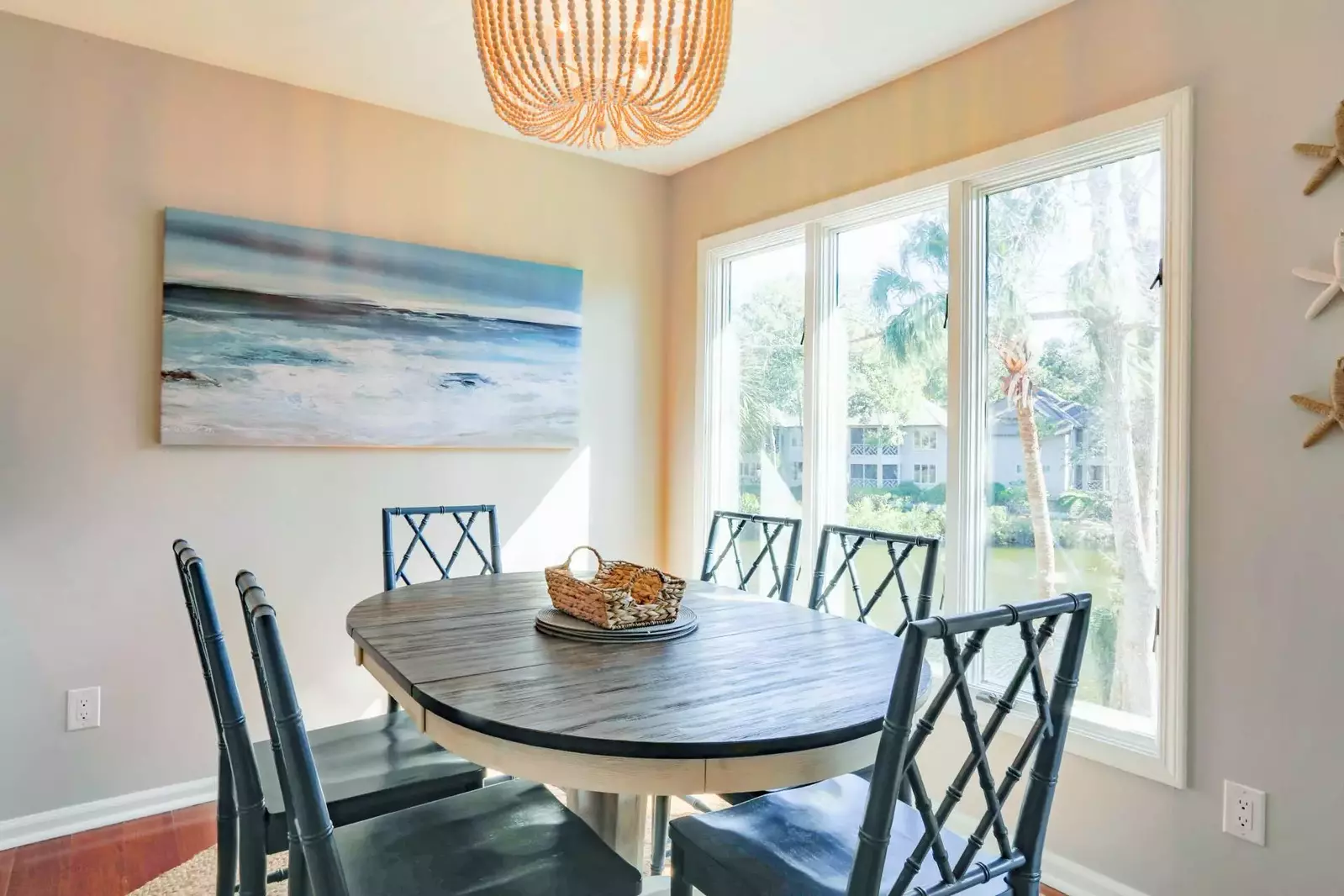 The kitchen, screened porch, living room and master suite overlook the lagoon behind the building.