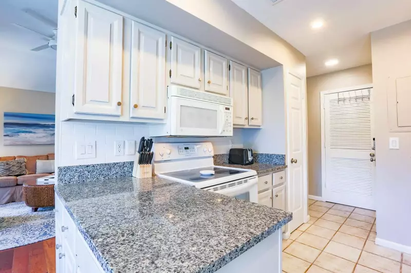 There is also a range, microwave, toaster and pantry in the kitchen.