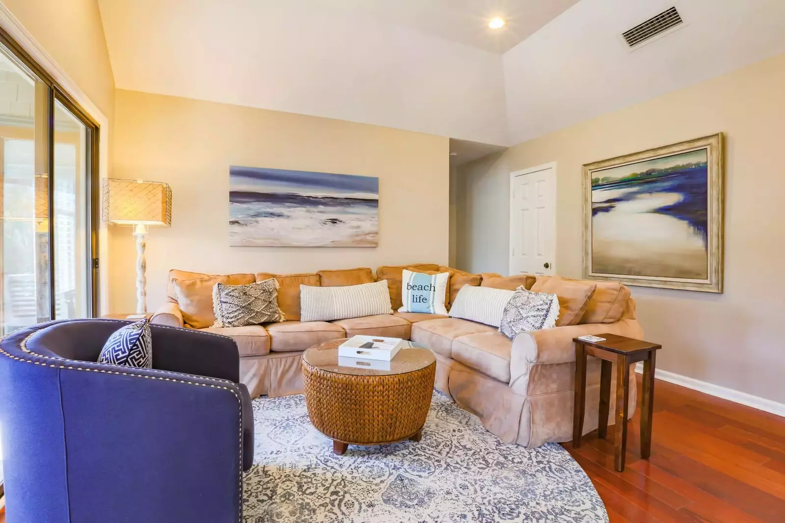 The master suite is located down the hall behind the sectional.
