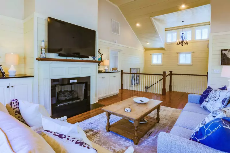 The living room is located at the top of the staircase from the first floor.