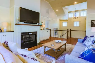 The living room is located at the top of the staircase from the first floor.