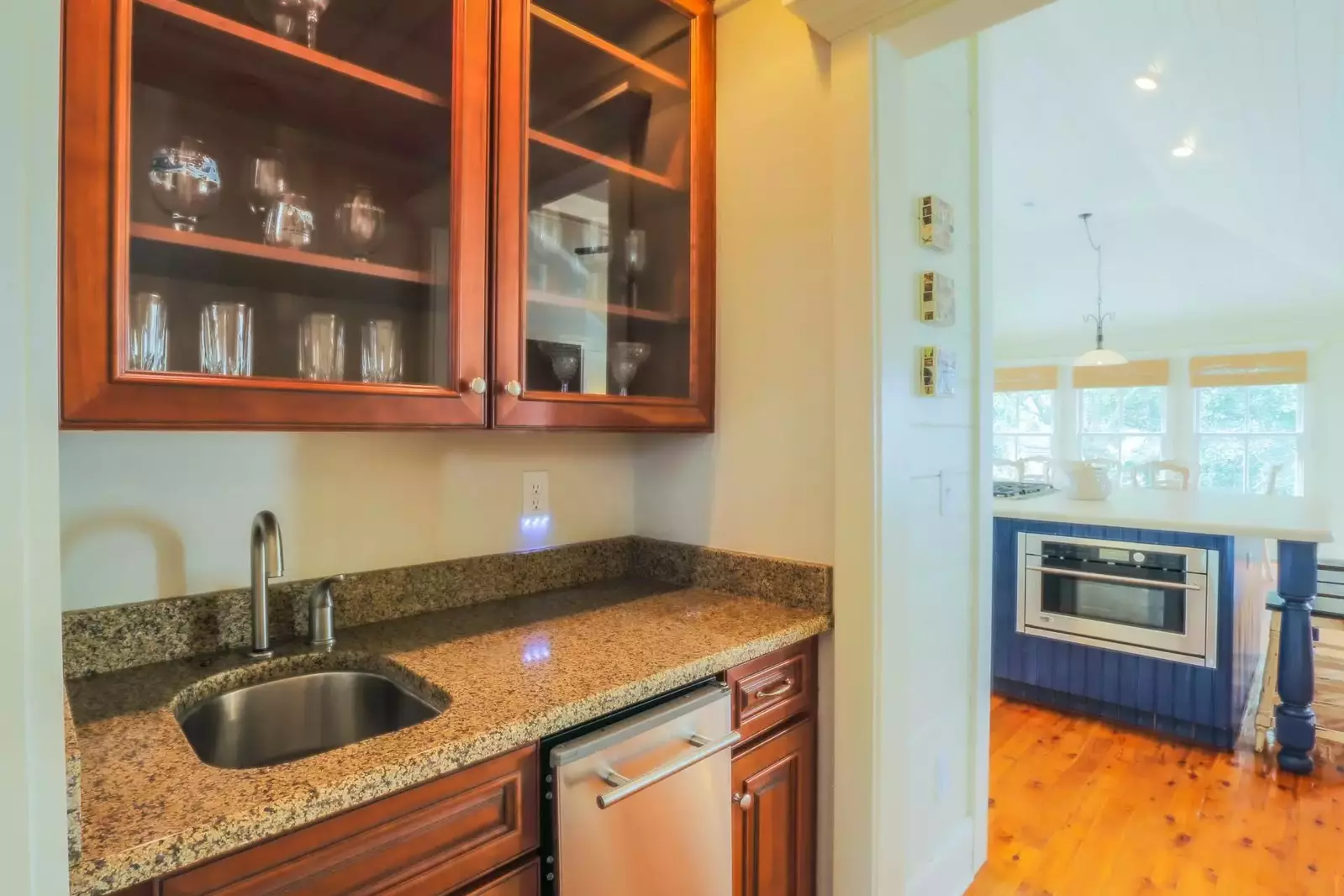 A butler's pantry separates the kitchen from the den.