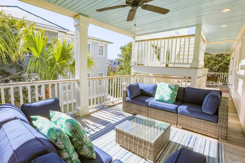 The covered deck off of the den features this terrific outdoor seating area.
