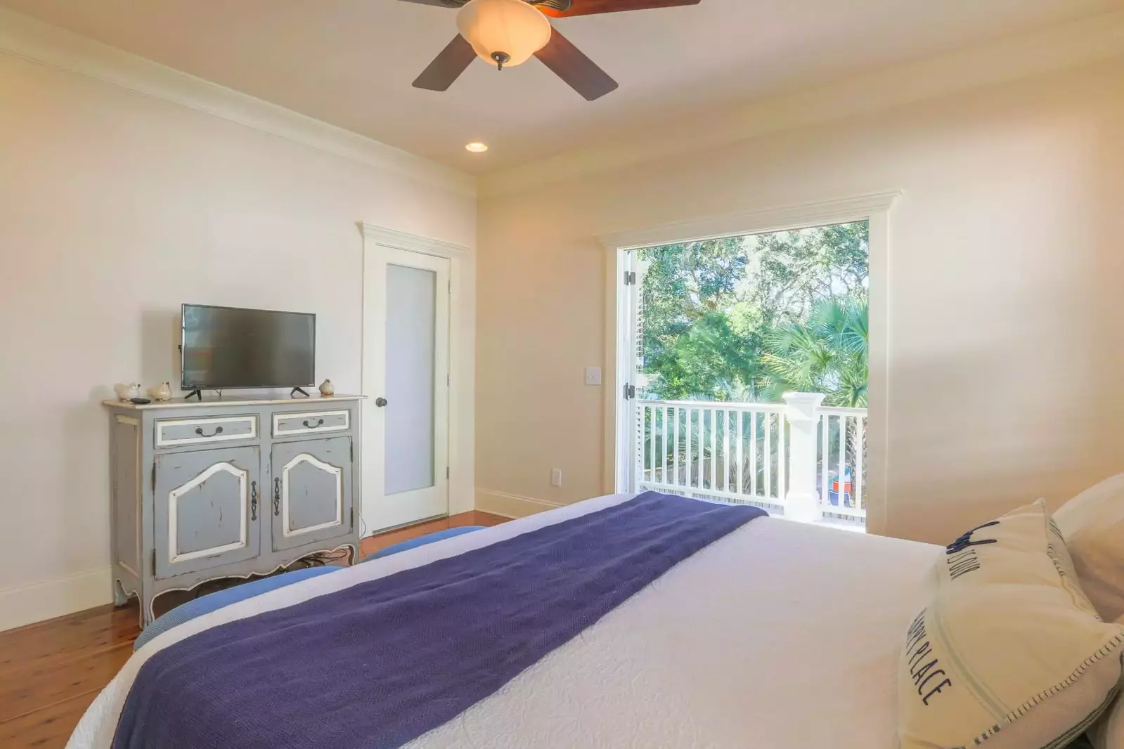 The second master suite also features a smart TV, an en suite bathroom and access to the home's back porch.