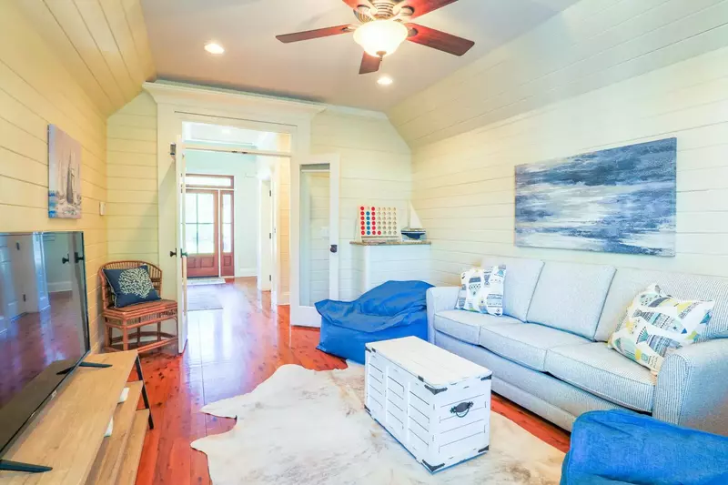 This game room is located on the lower level near the home's front door.