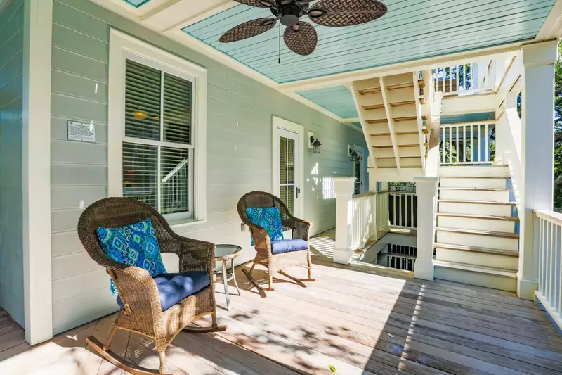 These rocking chairs are located on the back just outside one of the home's guest bedrooms.