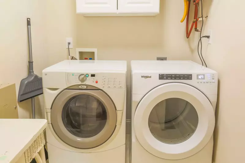 There is a full-sized washing machine and dryer located on the first floor of the home.