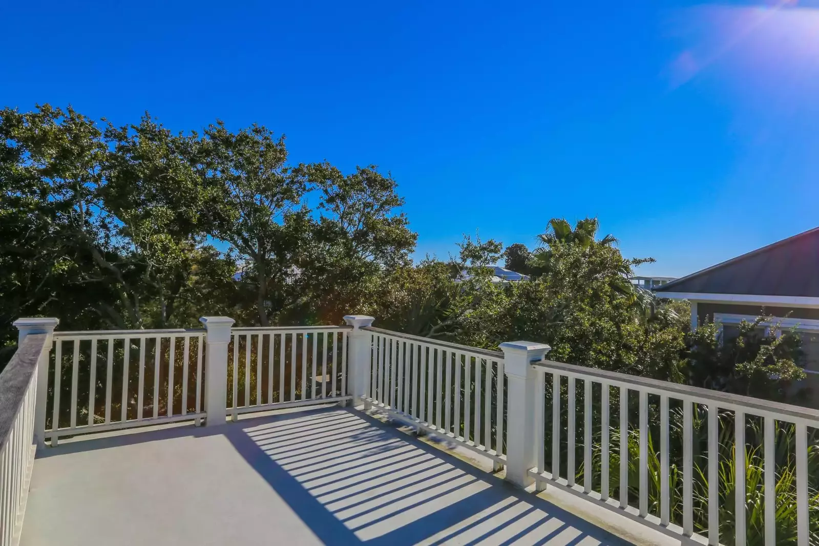You can see glimpses of the ocean from the home's roof deck.