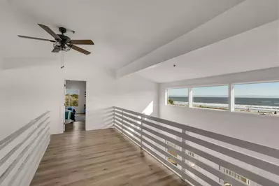This walkway with stunning ocean views connects the two upstairs bedrooms.