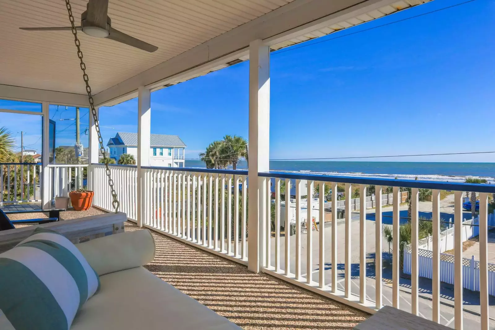 The covered front porch is the perfect spot to watch the crashing waves and feel the ocean breezes.