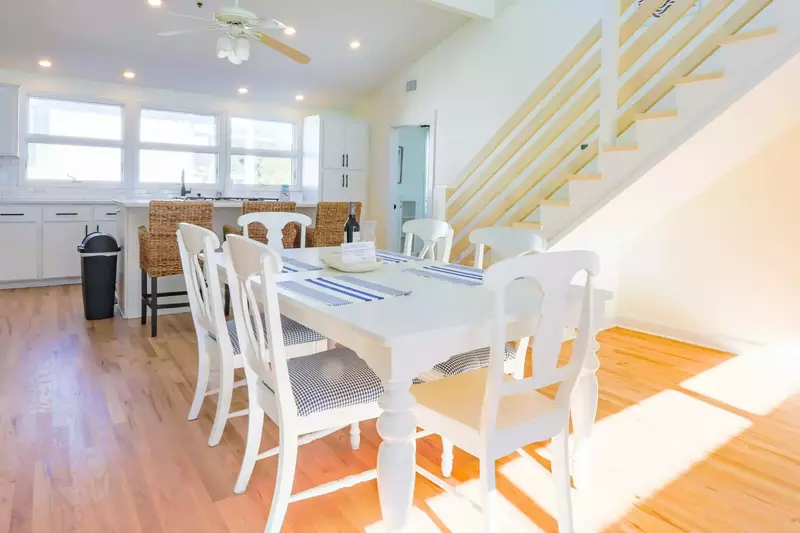 The Penthouse is configured around this central dining room, living room and kitchen.
