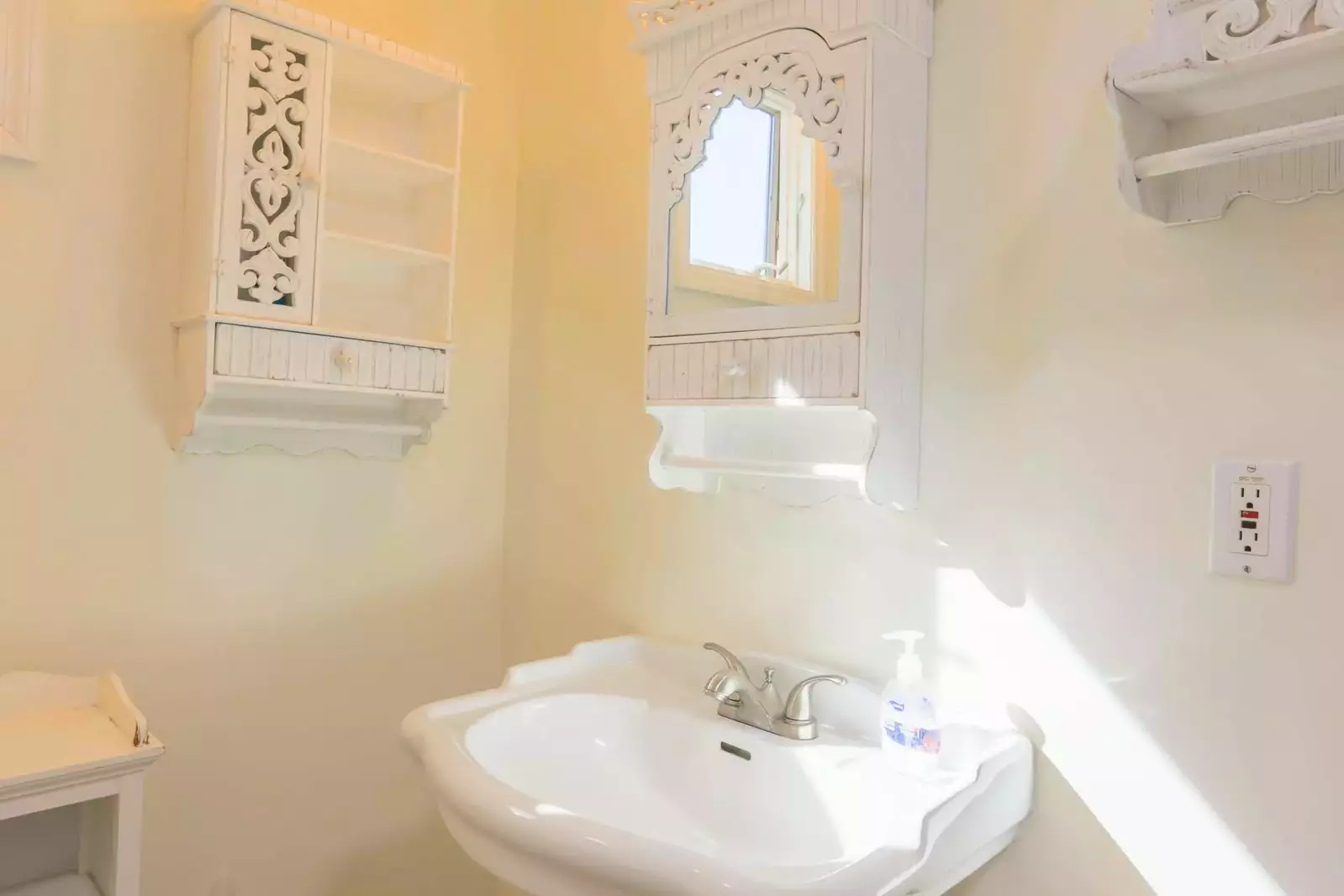 The Jack & Jill bathroom features a pedestal sink and storage areas for your personal belongings.