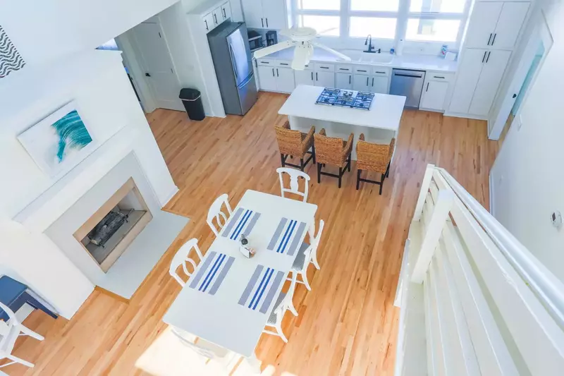 The walkway between the two loft rooms provides this bird's-eye view of the beautiful new hardwood floors below.