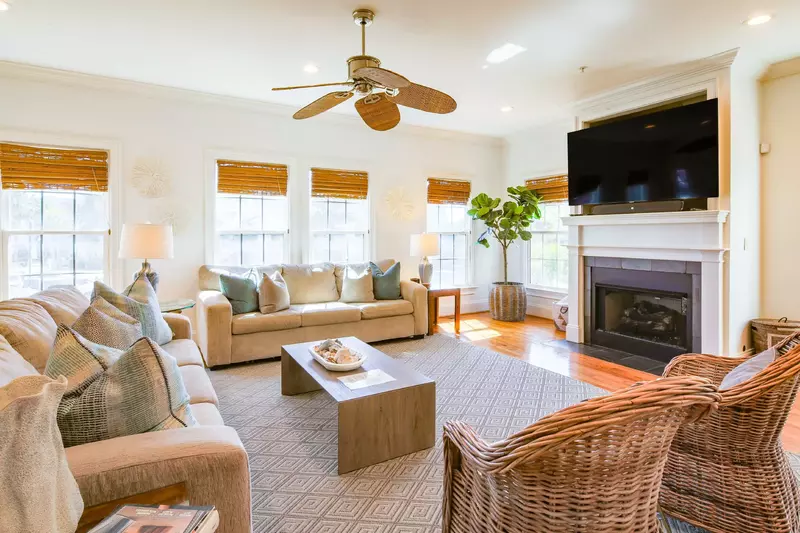All For You features this spacious living room with mounted large screen TV.