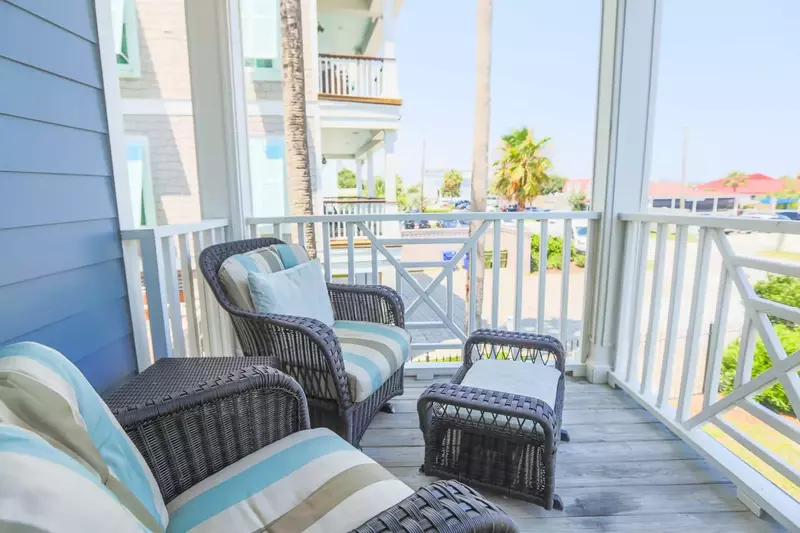 Enjoy your morning coffee or evening beverage of choice on this covered balcony.