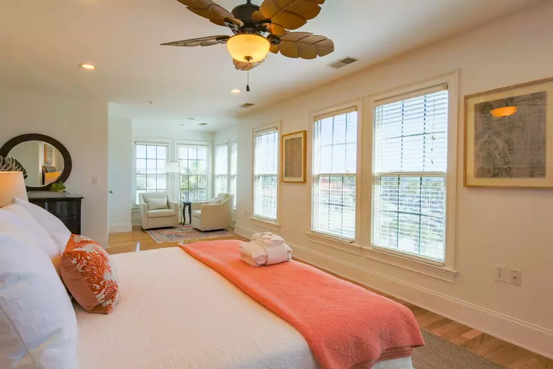 The master suite receives wonderful natural light through its many windows.