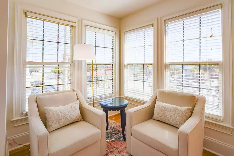 This sunny seating area is the perfect spot to enjoy your morning coffee or a good book.