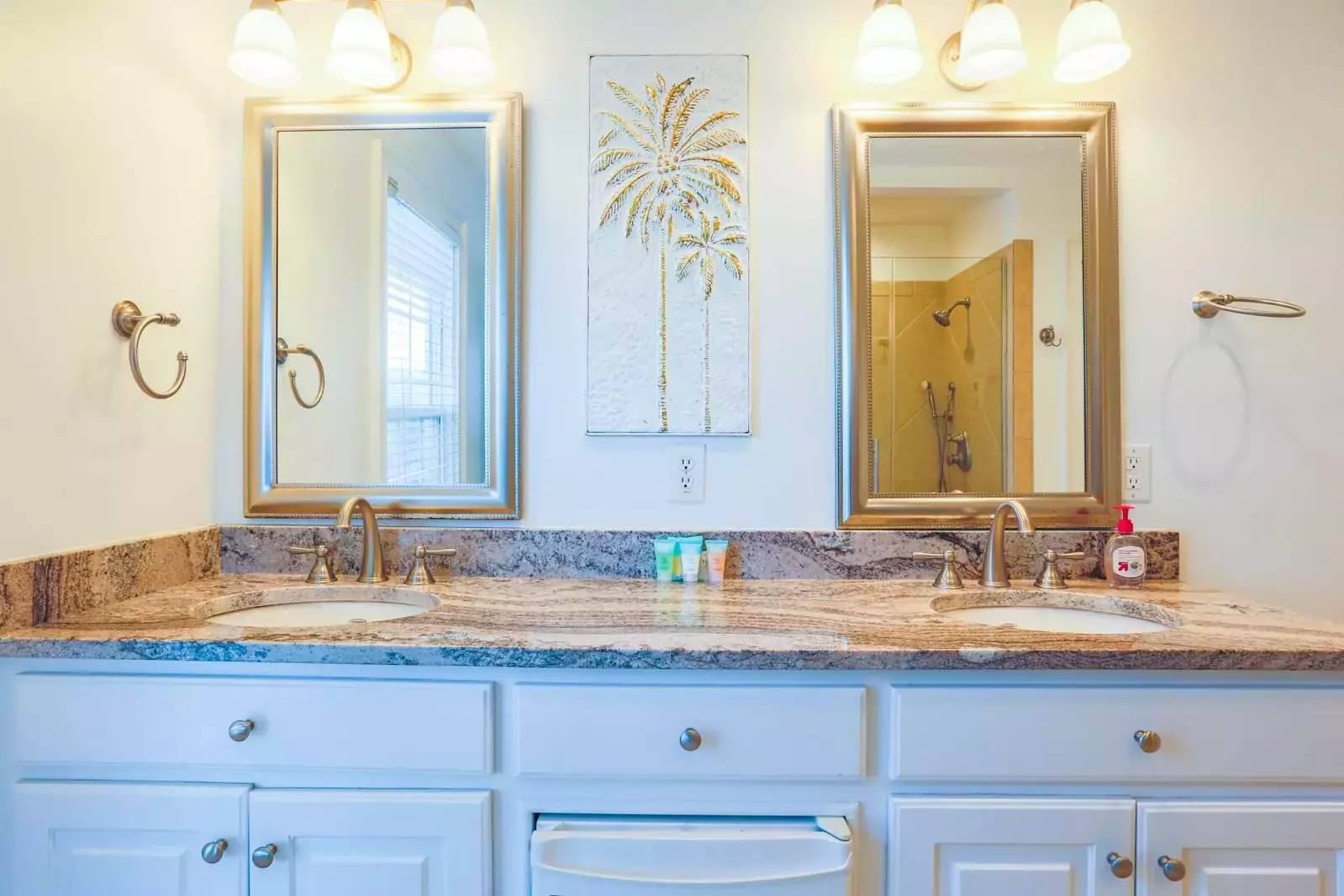 The en suite bathroom features a double sink vanity.