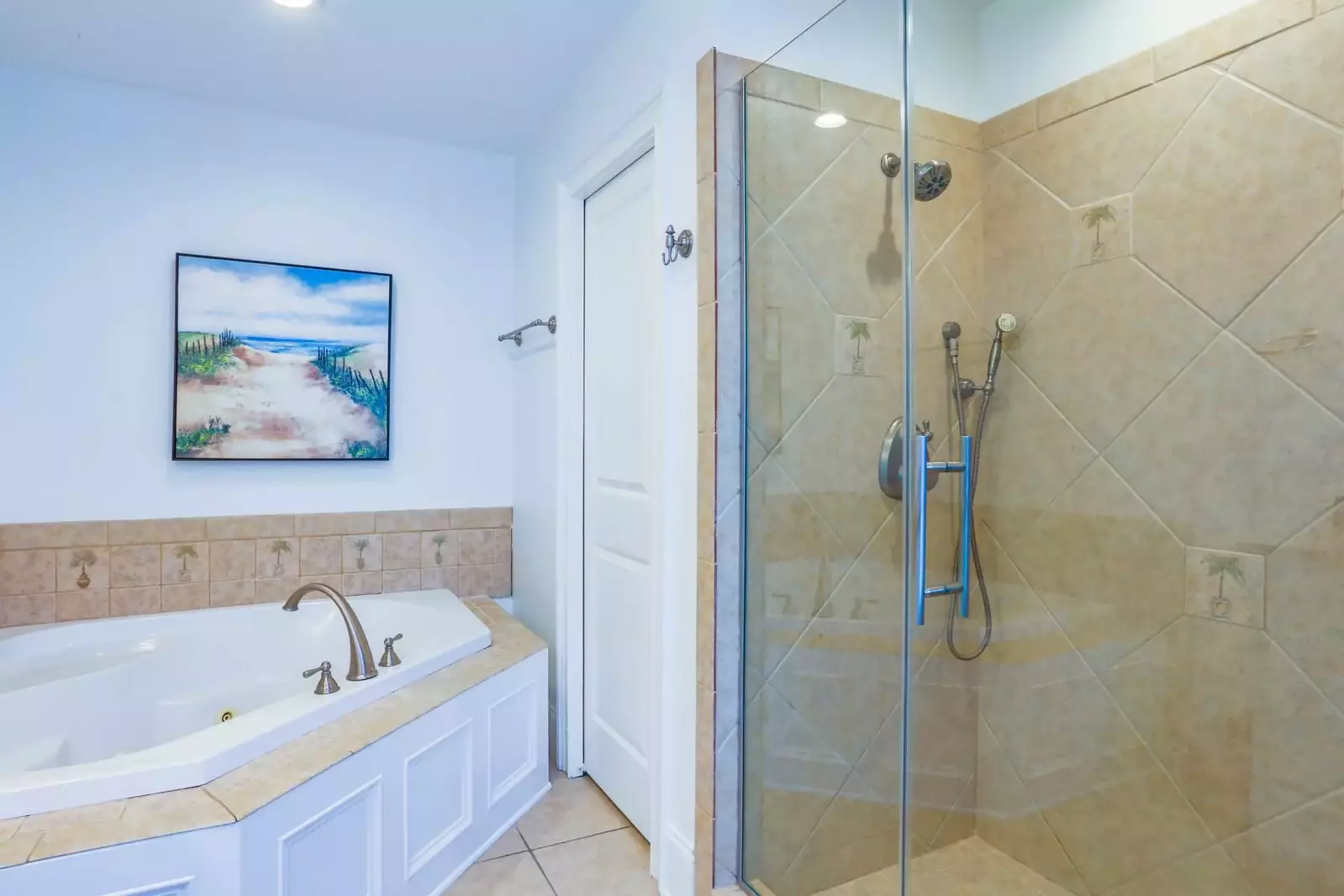 The master bathroom also has a corner jacuzzi tub and a walk-in shower.
