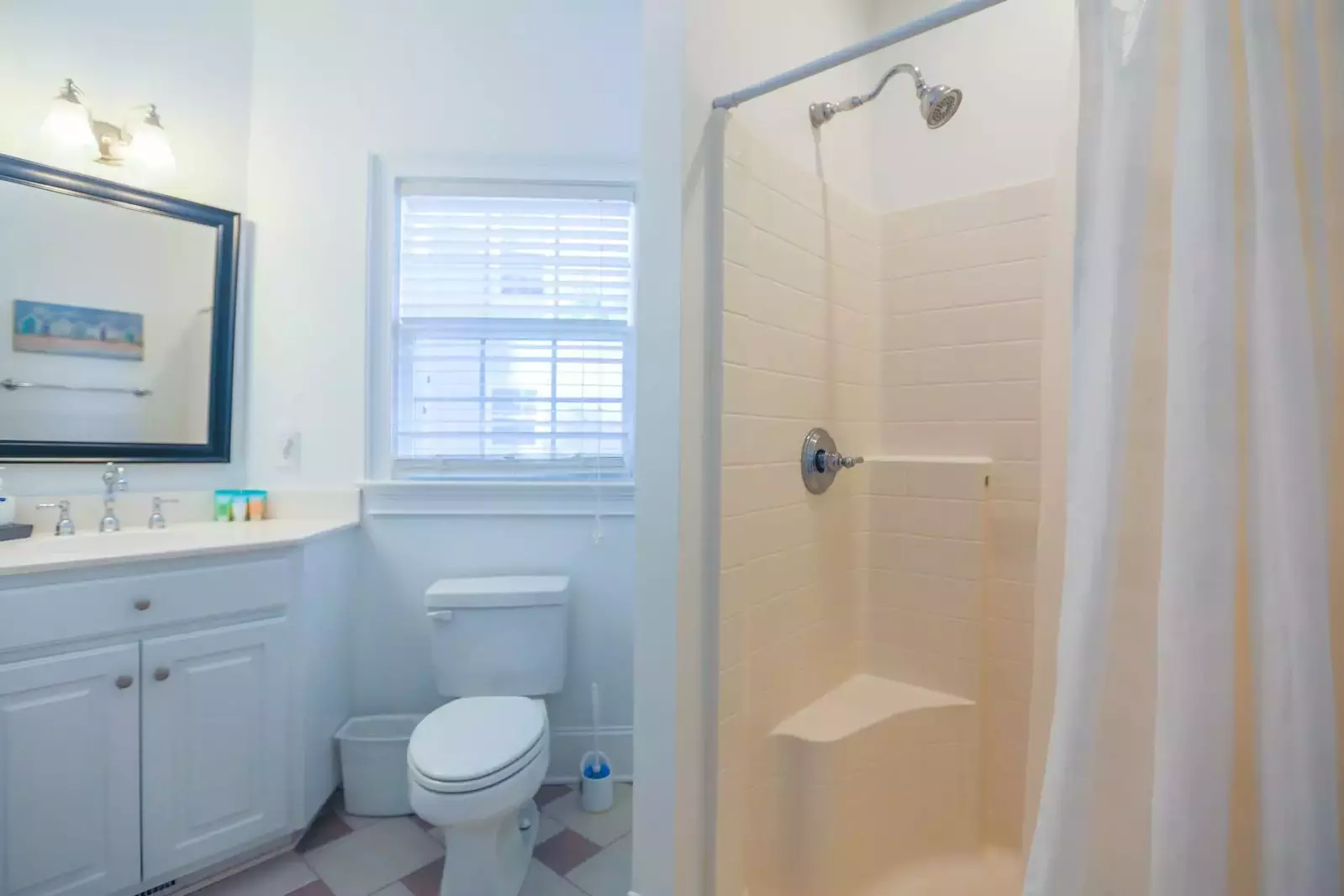The first floor Jack & Jill bathroom features a spacious vanity and a walk-in shower.