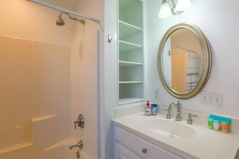 This bathroom with a shower/tub combo is accessible from the 2nd floor hallway.