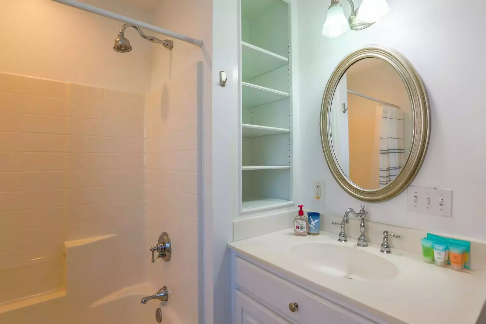 This bathroom with a shower/tub combo is accessible from the 2nd floor hallway.