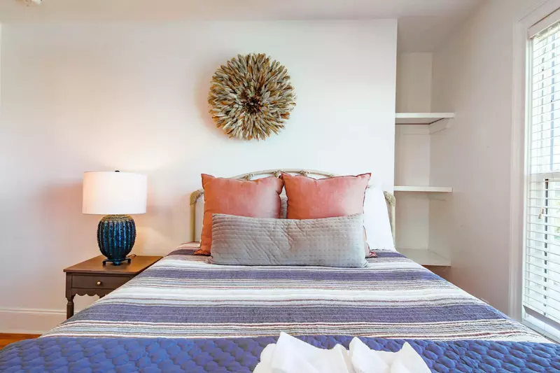 This second floor guest bedroom has a queen bed.