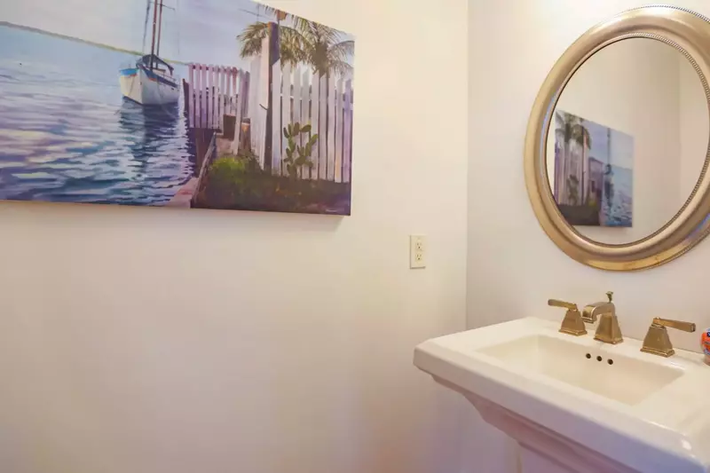 This half bathroom is located on the home's lower level.