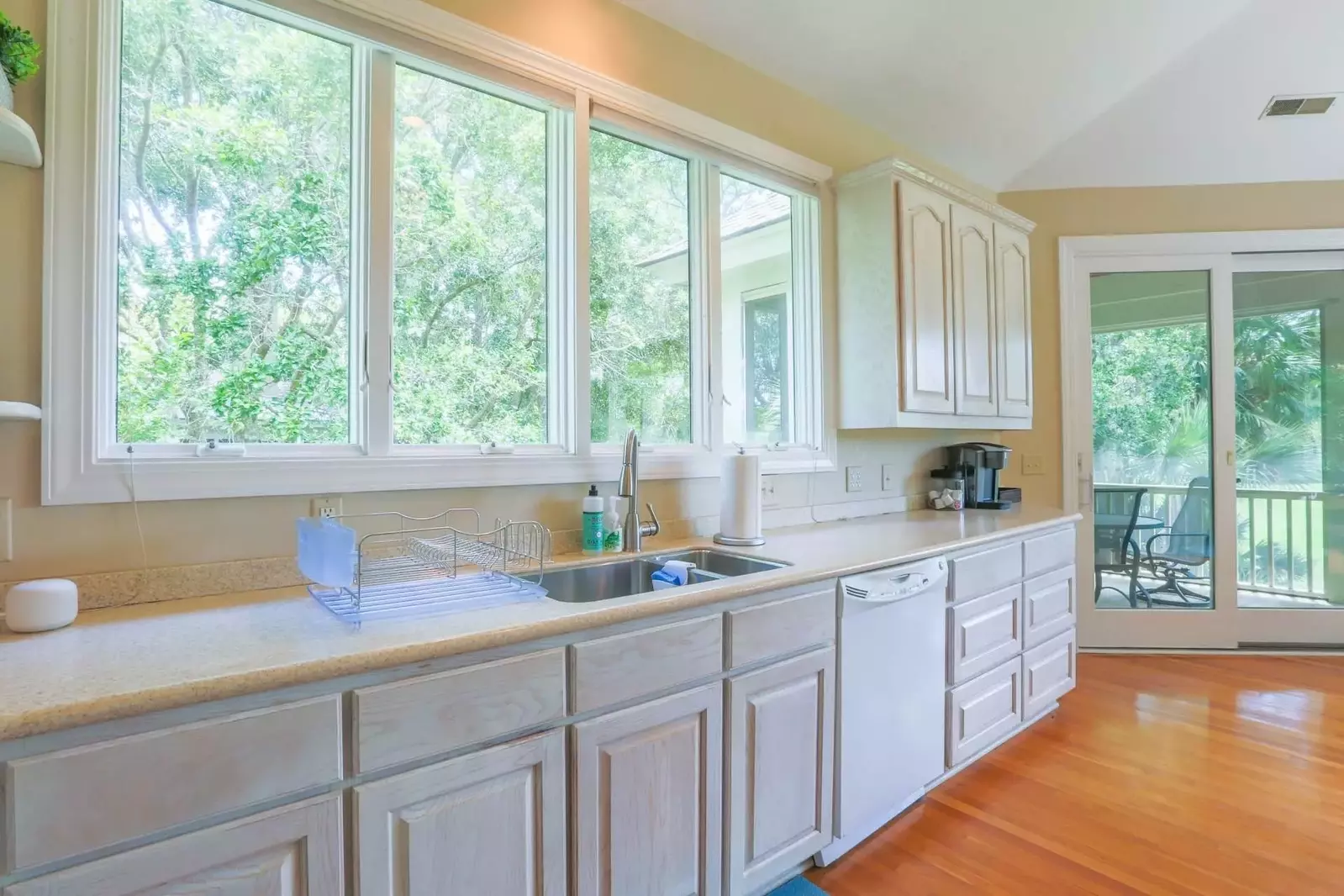 The spacious home receives terrific natural light through its many windows and sliding glass doors.